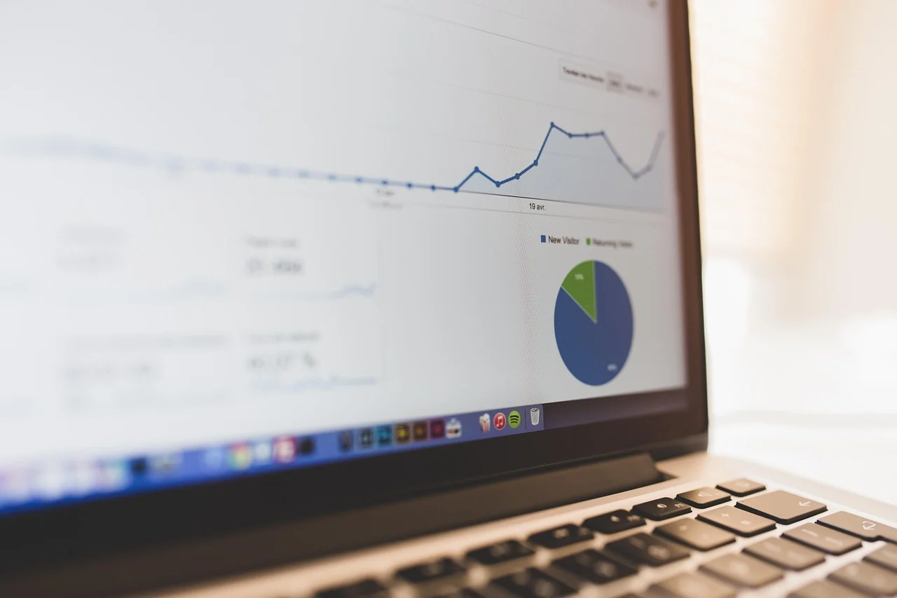 Person analyzing Google Search Console and Analytics dashboards on laptop