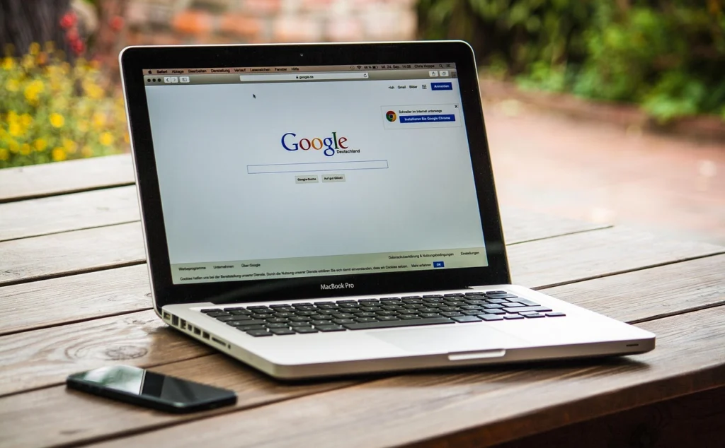 Open laptop with multiple browser tabs showing free SEO tools like Google Search Console and Keyword Planner for small budgets