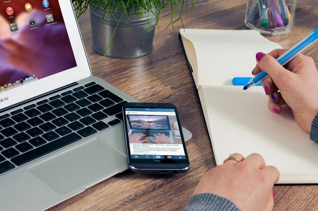 Hand writing SEO keywords and notes about impressions and clicks