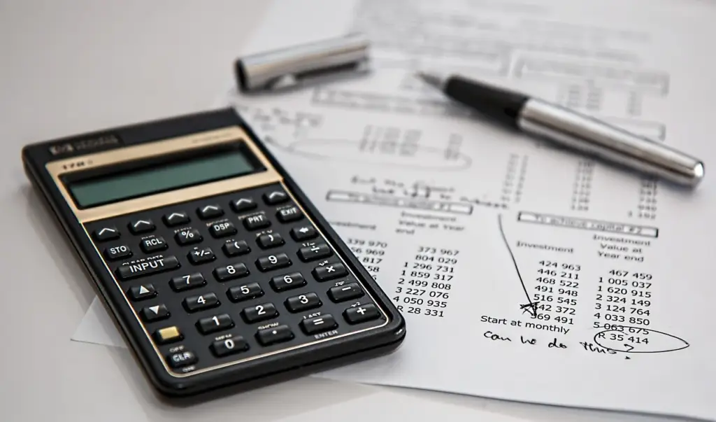 A person analyzing a website audit report on a laptop screen
